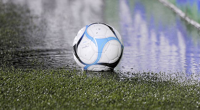 Soccer ball in rain